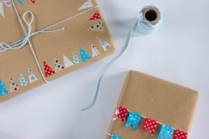 String tied gifts covered with brown paper