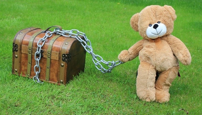 Treasure chest guarded by a teddy bear